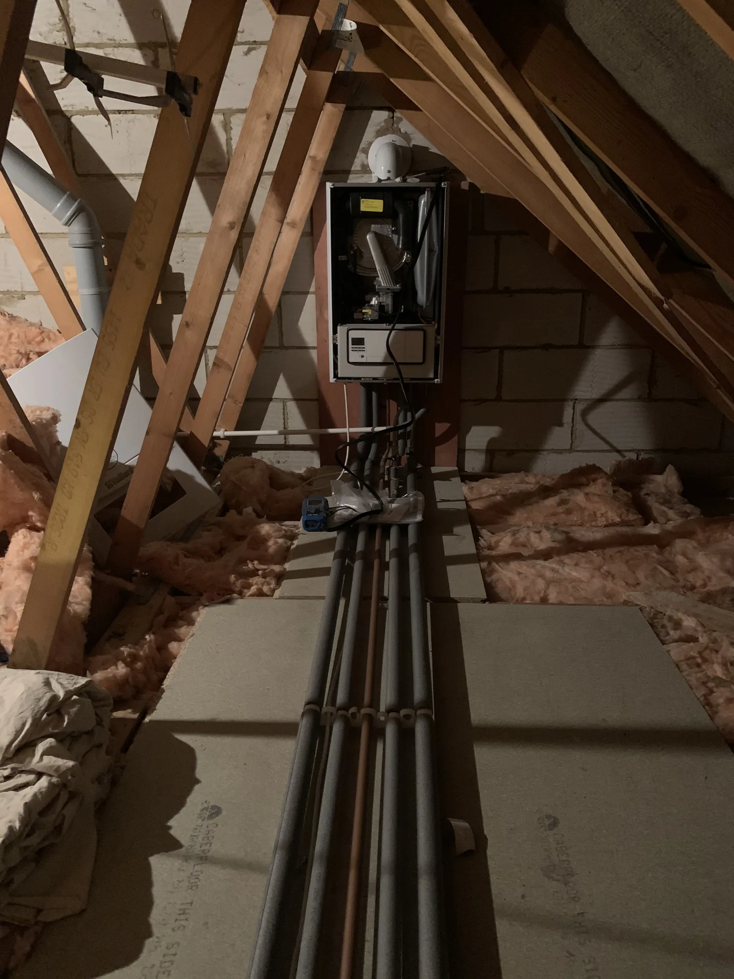 Loft boiler installation showing pipework detail
